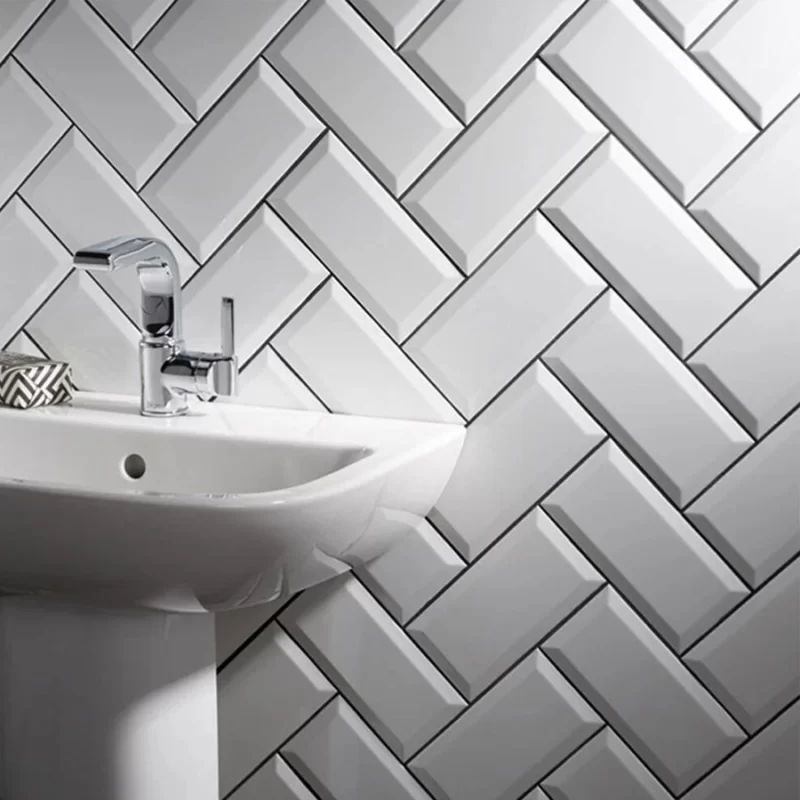 metro white tiles in 100x200mm in a bathroom in herringbone style.