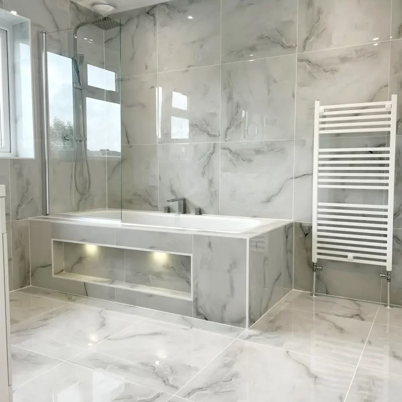 dolmen grey onyx porcelain wall and floor tiles in 60x60cm tiled in a bathroom.